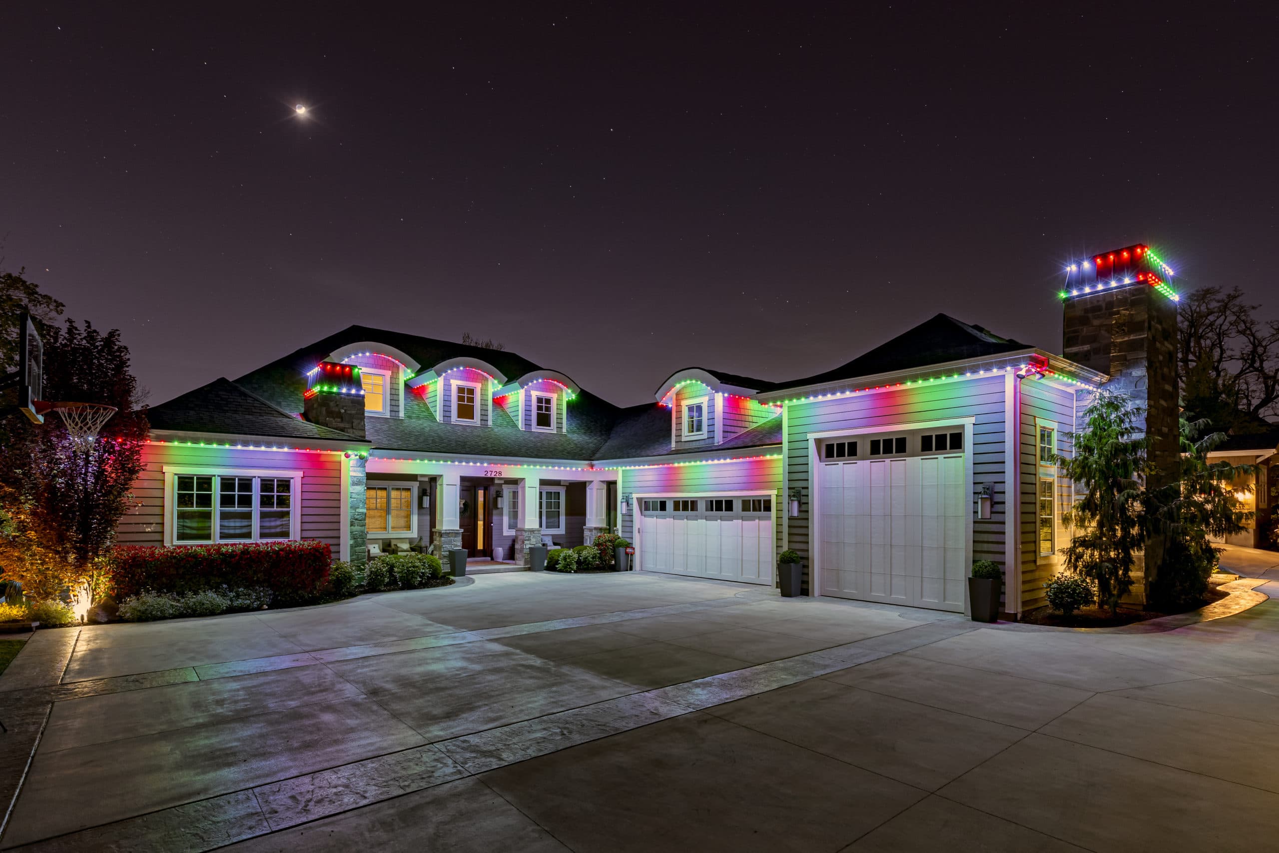 Govee permanent outdoor lights in warm white for holiday season on a two-storey home